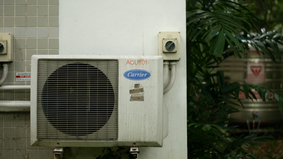 Outdoor unit of a split air conditioner on a tiled wall