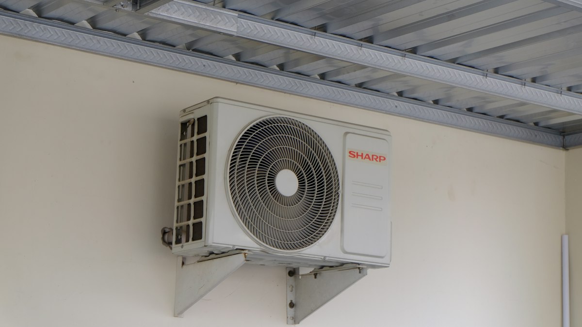 Outdoor unit of a split AC mounted on a wall bracket
